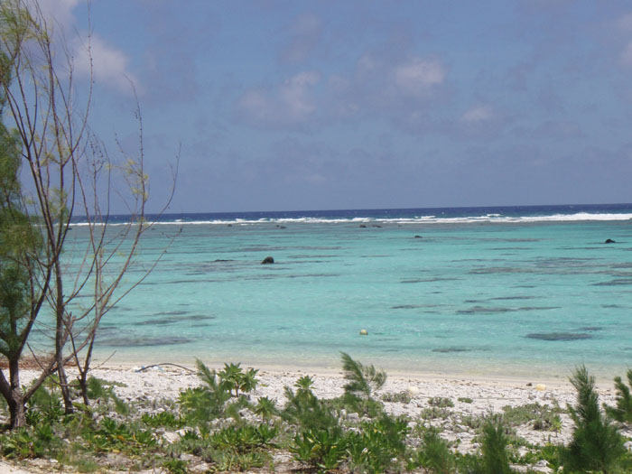 Surf breaking on the northern reef