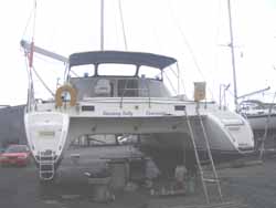 Under the boat makes a good dry workshop.  The top of the boat feels like a tree house as we climb up and down the ladder to our home