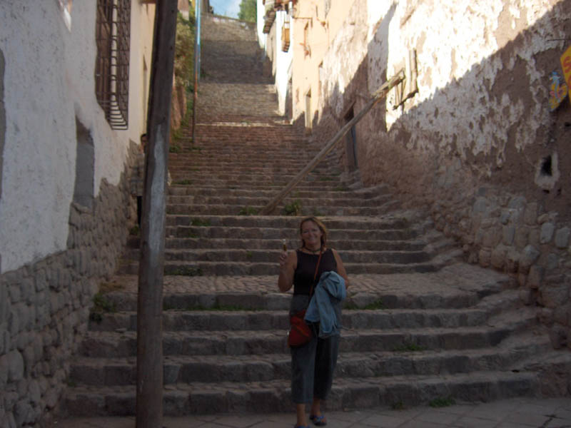 Shar on the stair with her finger puppet - the puppet would tell the street hawkers - no gratias