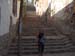 Shar on the stair with her finger puppet - the puppet would tell the street hawkers - no gratias