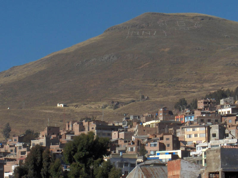 The hills around Puno are etched with slogans